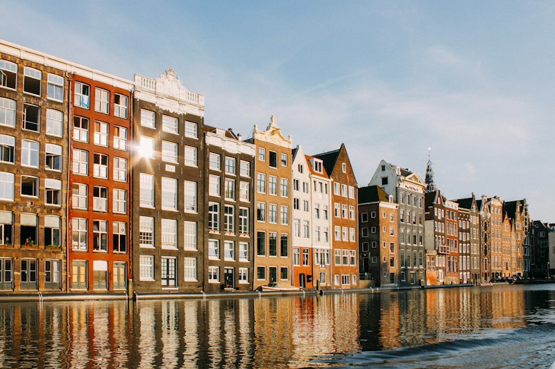 Canal houses on the Damrak in morning light