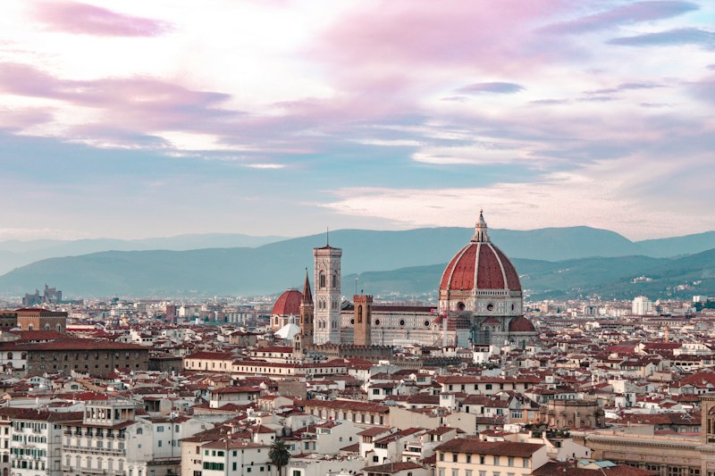Florence rooftops and Brunelleschi's dome at dusk